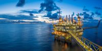 Panorama of Oil and Gas central processing platform in twilight, offshore hard work occupation twenty four working hours.
